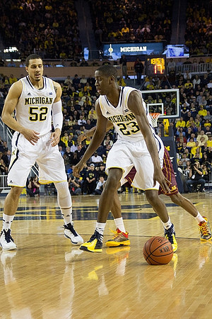 Jordan Morgan (52) and Caris LeVert (23)