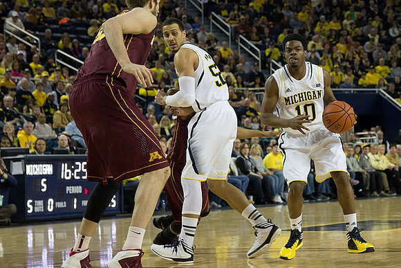 Jordan Morgan (52) and Derrick Walton Jr. (10)