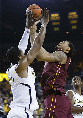 Glenn Robinson III (1) and Caris LeVert (23)