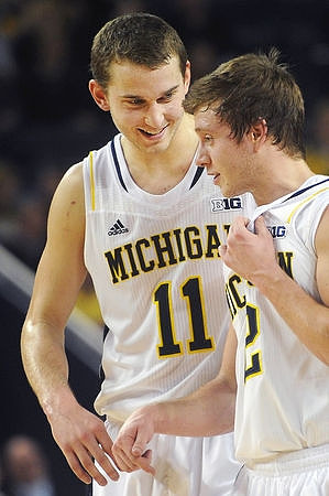 Nik Stauskas (11) and Spike Albrecht (2)