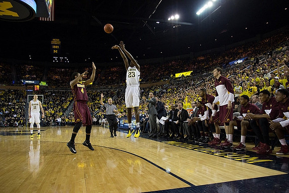 Nik Stauskas (11) and Caris LeVert (23)