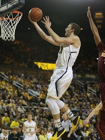 Nik Stauskas (11) and Spike Albrecht (2)