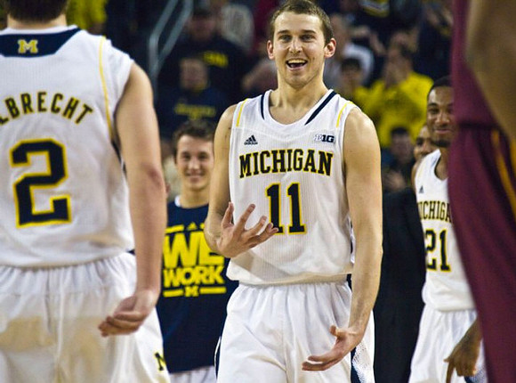 Spike Albrecht (2), Andrew Dakich (5), Nik Stauskas (11), and Zak Irvin (21)