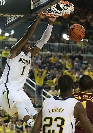 Glenn Robinson III (1) and Caris LeVert (23)