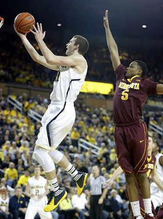Nik Stauskas (11) and Spike Albrecht (2)