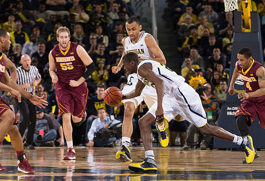 Jon Horford (15) and Caris LeVert (23)