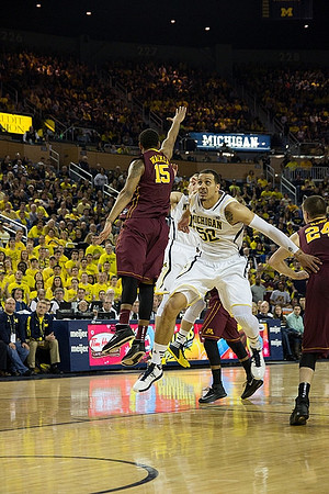 Nik Stauskas (11) and Jordan Morgan (52)
