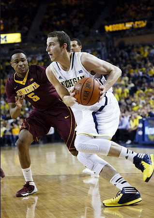 Nik Stauskas (11) and Jordan Morgan (52)