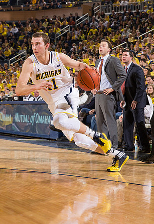 Nik Stauskas (11) and Minnesota Head Coach Richard Pitino