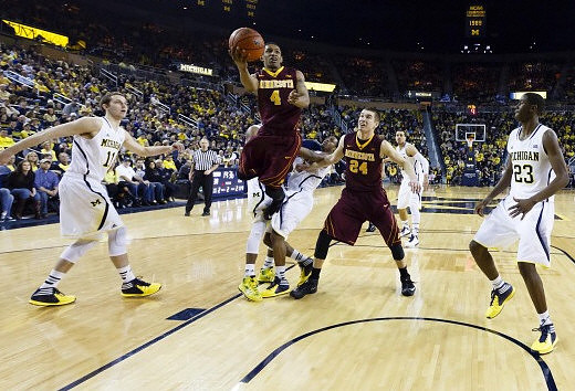 Nik Stauskas (11), Derrick Walton Jr. (10), Jordan Morgan (52), and Caris LeVert (23)