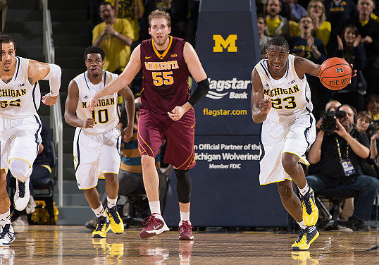 Jordan Morgan (52), Derrick Walton Jr. (10), and Caris LeVert (23)