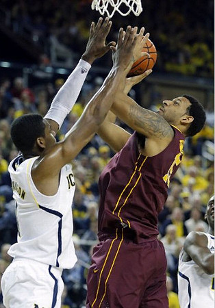 Glenn Robinson III (1) and Caris LeVert (23)