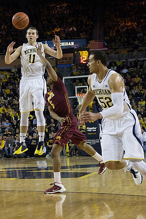 Nik Stauskas (11) and Jordan Morgan (52)