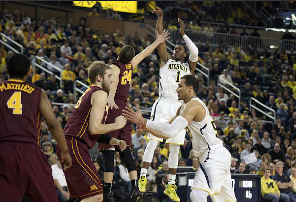 Glenn Robinson III (1) and Jordan Morgan (52)