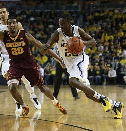 Jordan Morgan (52) and Caris LeVert (23)