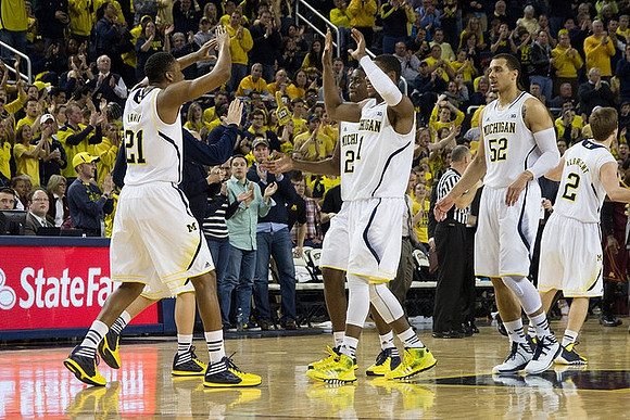 Zak Irvin (21), Caris LeVert (23), Glenn Robinson III (1), Jordan Morgan (52), and Spike Albrecht (2)