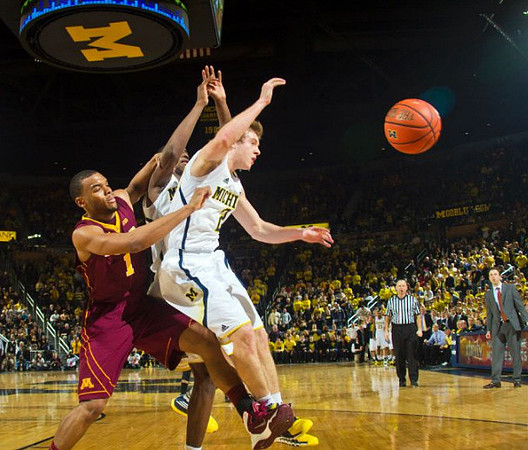 Spike Albrecht (2) and Minnesota Head Coach Richard Pitino
