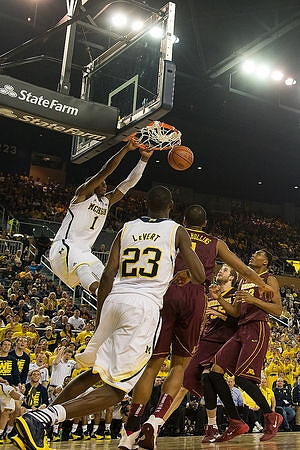 Glenn Robinson III (1) and Caris LeVert (23)
