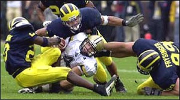Marlin Jackson (20), Larry Foote (17), and Jake Frysinger (99)
