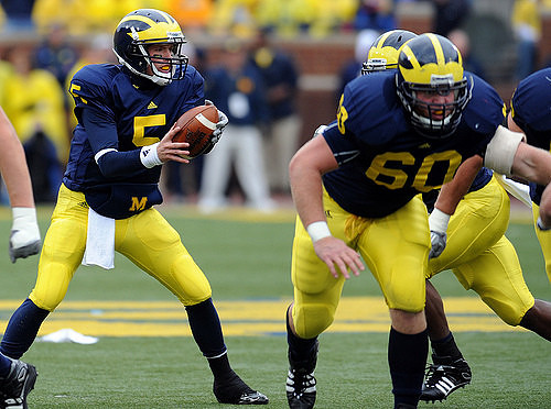 Tate Forcier (5) and David Moosman (60)