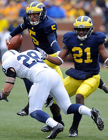 Tate Forcier (5) and Junior Hemingway (21)