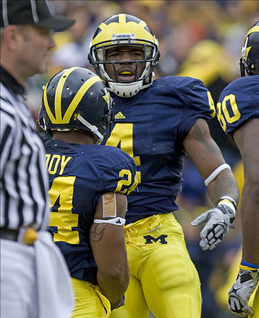Kevin Grady (24), Brandon Minor (4), and Martell Webb (80)