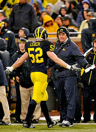 Kevin Leach (52) and Rich Rodriguez