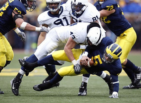 Stephen Schilling (52), Tate Forcier (5), and Mark Huyge (72)