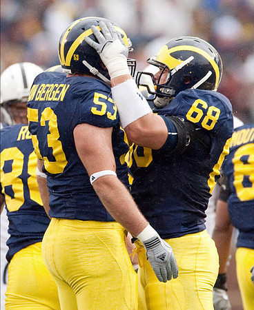 Craig Roh (88), Ryan Van Bergen (53), Mike Martin (68), and Jonas Mouton (8)