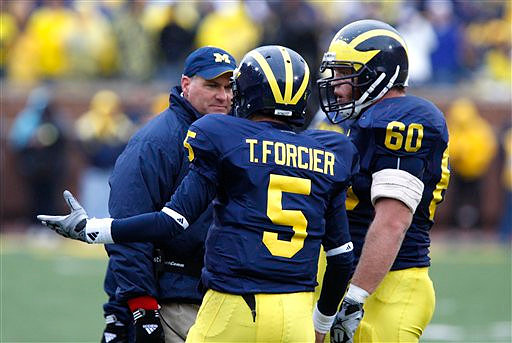 Rich Rodriguez, Tate Forcier (5), and David Moosman (60)