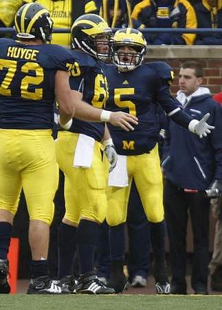 Mark Huyge (72), David Moosman (60), and Tate Forcier (5)