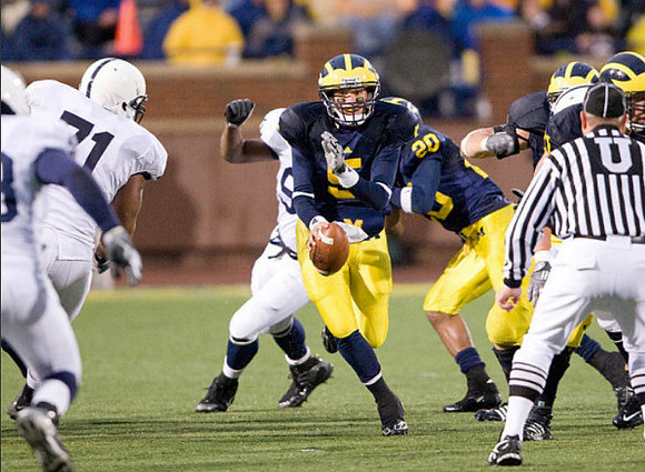 Tate Forcier (5) and Michael Shaw (20)