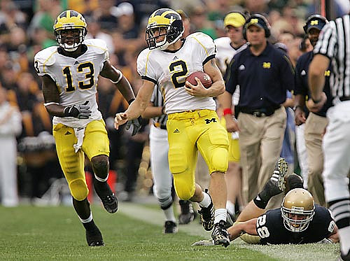 Sam McGuffie (2) and Greg Mathews (13)