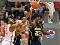 Mark Donnal (34) and Caris LeVert (23)