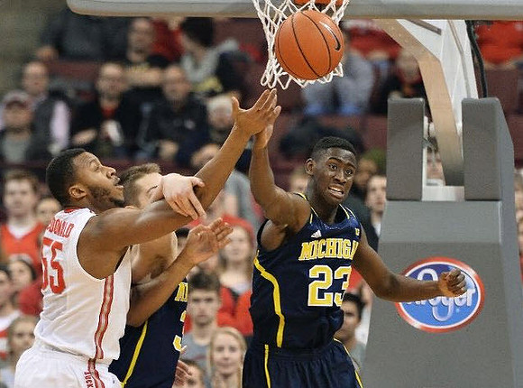 Mark Donnal (34) and Caris LeVert (23)