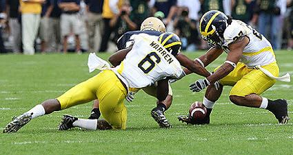 Donovan Warren (6) and Brandon Harrison (27)