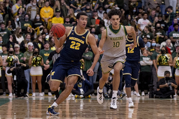 Caleb Houstan (22) and DeVante' Jones (12)