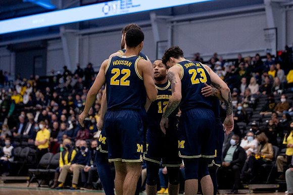 Hunter Dickinson (1), Caleb Houstan (22), DeVante' Jones (12), and Brandon Johns Jr. (23)