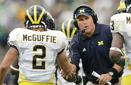 Sam McGuffie (2) and Rich Rodriguez