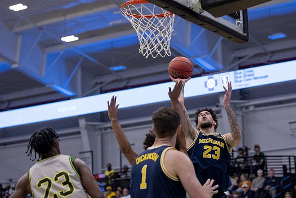 Hunter Dickinson (1) and Brandon Johns Jr. (23)