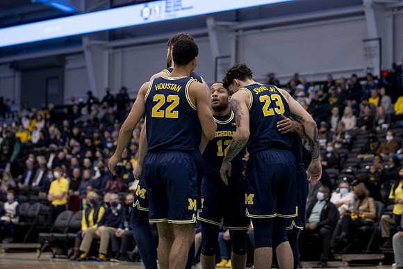 Hunter Dickinson (1), Caleb Houstan (22), DeVante' Jones (12), and Brandon Johns Jr. (23)