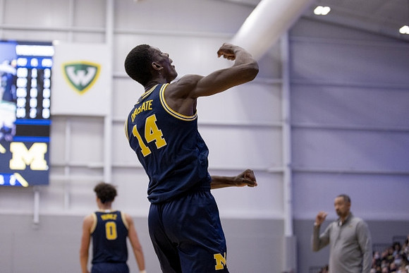 Moussa Diabate (14), Adrien Nunez (0), and Juwan Howard