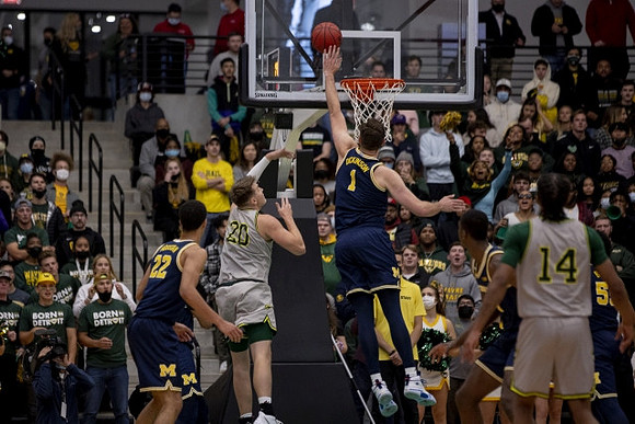 Caleb Houstan (22), Hunter Dickinson (1), and Eli Brooks (55)