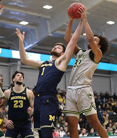 Brandon Johns Jr. (23) and Hunter Dickinson (1)