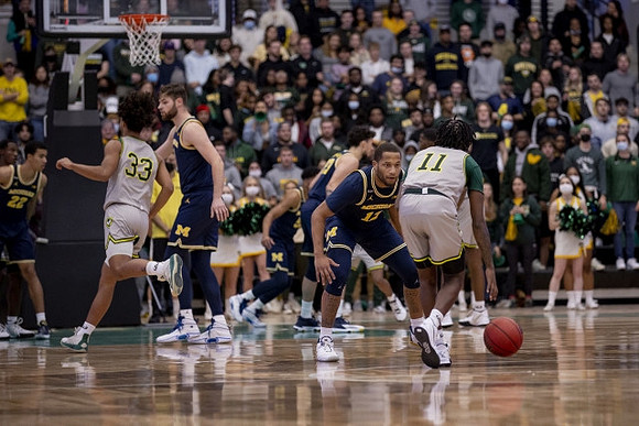 Caleb Houstan (22), Hunter Dickinson (1), Eli Brooks (55), Brandon Johns Jr. (23), and DeVante' Jones (12)
