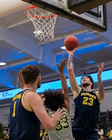 Hunter Dickinson (1) and Brandon Johns Jr. (23)