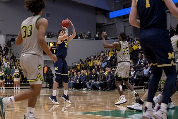 Brandon Johns Jr. (23) and Hunter Dickinson (1)