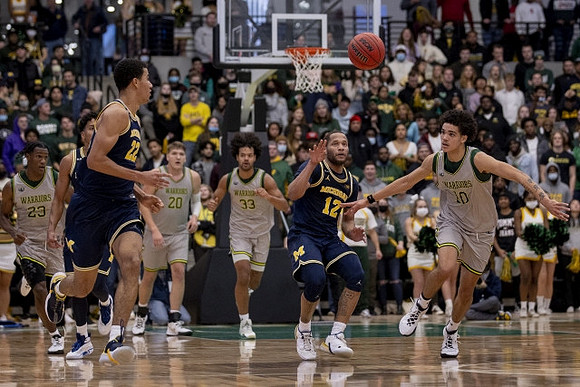 Caleb Houstan (22) and DeVante' Jones (12)