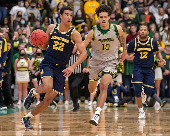 Caleb Houstan (22) and DeVante' Jones (12)