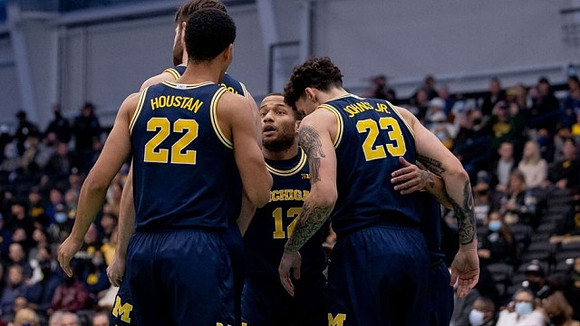 Hunter Dickinson (1), Caleb Houstan (22), DeVante' Jones (12), and Brandon Johns Jr. (23)